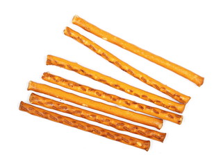 Salty cracker pretzel sticks isolated on white background, top view