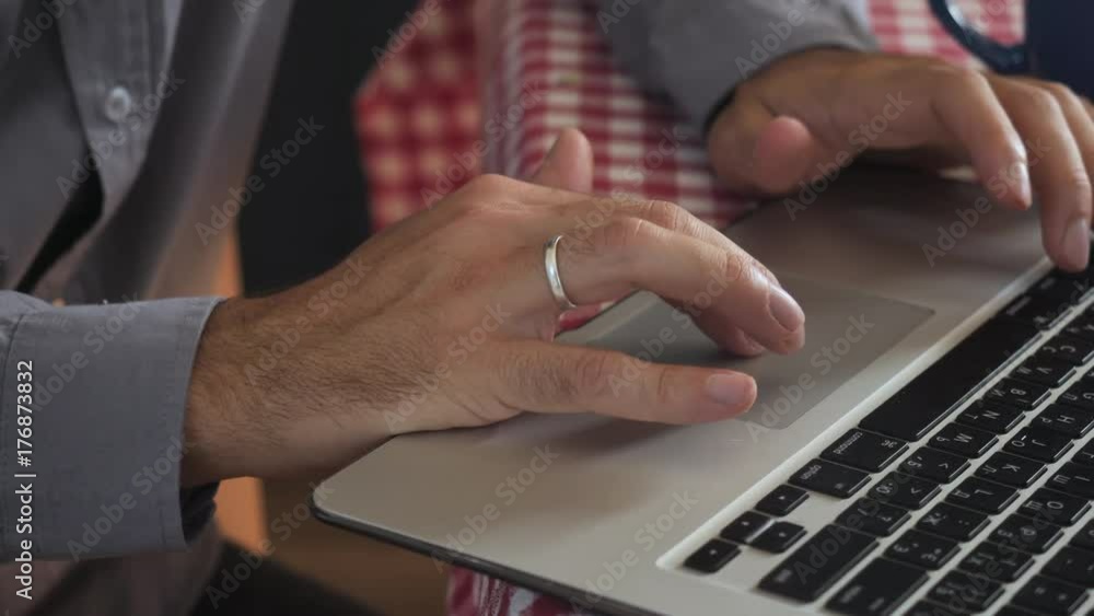 Poster close up details man typing on laptop. male hands entering data on keyboard