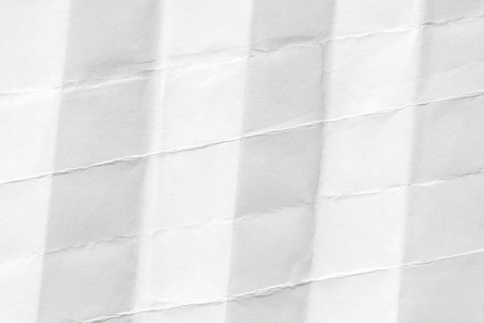 White paper background. The texture is old with kinks and dents.