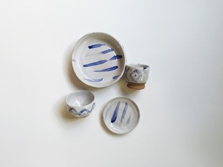 Hand painted and handmade white glazed pottery with indigo aztec pattern design