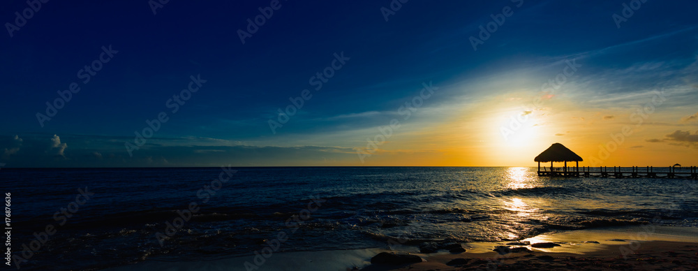 Wall mural gazebo bridge caribbean sea at sunset