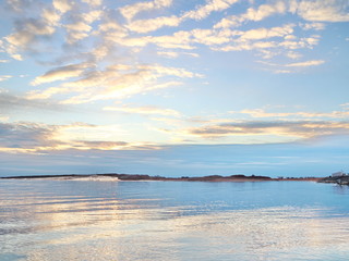 Obraz premium autumn sunset on the sea coast in the city