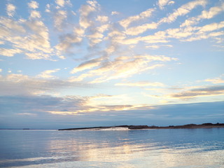 Naklejka premium autumn sunset on the sea coast in the city