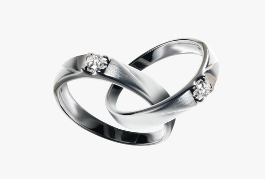 Two Platinum wedding rings with diamond hook together , Isolate on white with Path