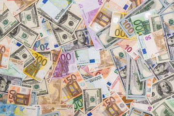 Obraz na płótnie Canvas pile of dollar and euro banknote as background