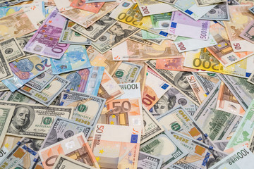 Fototapeta na wymiar pile of dollar and euro banknote as background