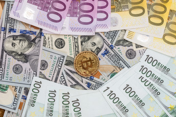 bitcoin with dollar and euro banknote