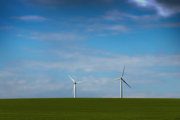 Fototapeta premium windmills making green energy at wind farm
