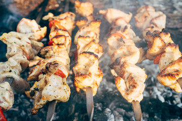 Grilling marinated shashlik on a grill