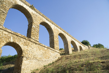 Fototapeta na wymiar Aqueduct in Almunecar, Granada province, Andalusia, Spain 