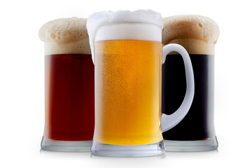 Mug collection of frosty dark red and light beer with foam isolated on a white background