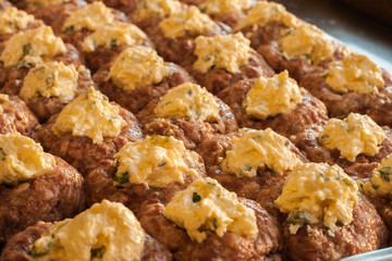 Process of cooking meatballs with cheese