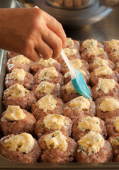 Process of cooking meatballs with cheese