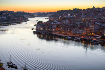 Douro river and Ribeira from Dom Luis I bridge at night, Porto, Portugal.