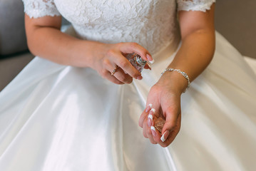 woman bride with a bottle of perfume