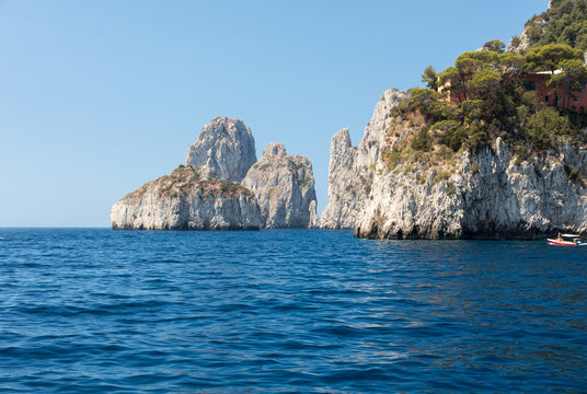  View from the boat on the Faraglioni Rocks on Capri Island, Italy.