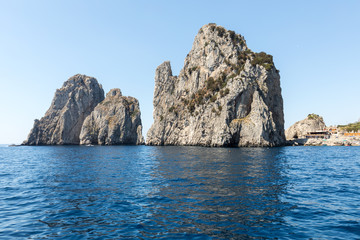 Fototapeta na wymiar View from the boat on the Faraglioni Rocks on Capri Island, Italy.