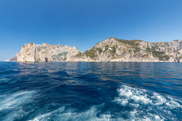 View from the boat on the cliff coast of Capri Island, Italy