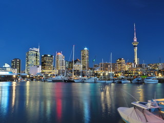 Night view of Auckland City and the Sky Tower from the harbor. (North Island, NZ)