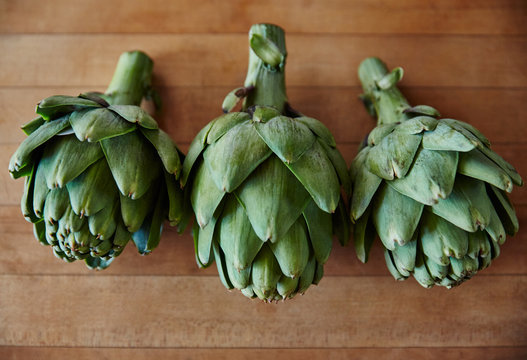 Artichokes On Wood Butcher Block Countertop