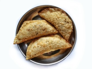 Diwali snack food karanji from maharashtra in india  isolated on white background.