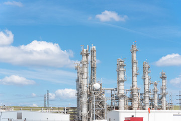 Oil refinery, oil factory, petrochemical plant in Pasadena, Texas, USA under cloud blue sky.