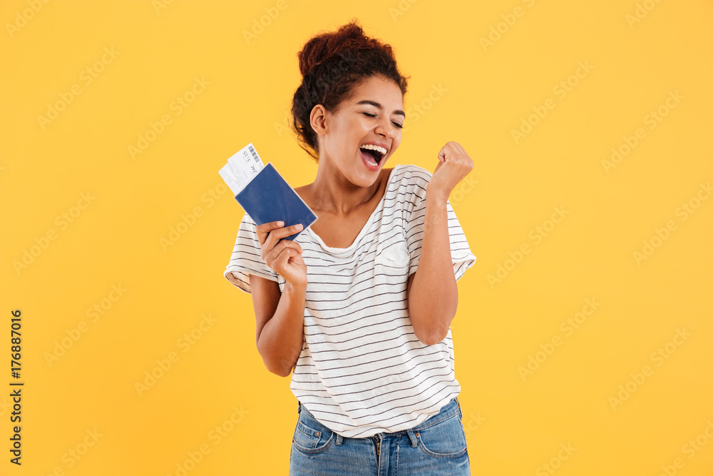 Poster Portrait of happy cheerful holding international passport isolated