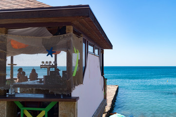 View at the part of balcony decorated with a fishnet with starfishes.