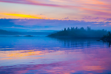 Russia. Karelia. Fog over the water. Ladoga lake.