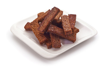 fried crackers of brown bread isolated on white background