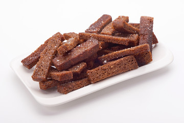 fried crackers of brown bread isolated on white background