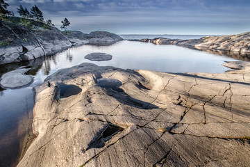 Calm. stones in the water. Northern landscape. Ladoga lake. Karelia. Russia.