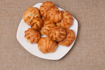Fresh fragrant tasty biscuits on a fabric background
