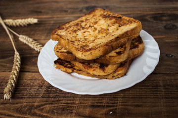 stack of french toast on wooden background