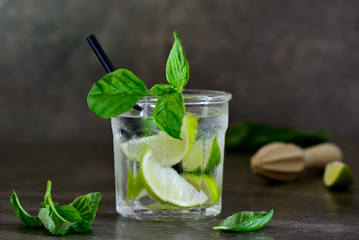Basil limeade or alcohol cocktail in a glass