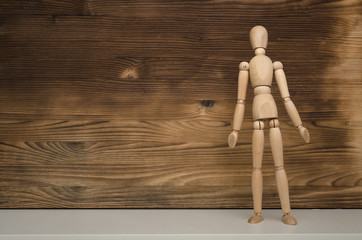 Guilty wooden man doll shrug their shoulders on wooden background with copy space. No results. Not found.