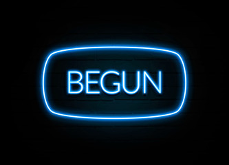Begun  - colorful Neon Sign on brickwall