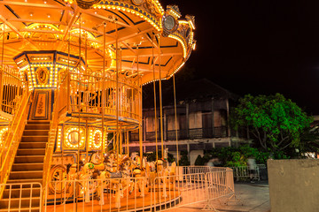 Selective focus to some part flying horse carousel, carnival background with Vintage filter.