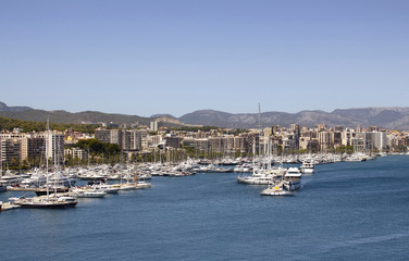 Fototapeta na wymiar Aerial view of Palma De Mallorca city and marina. It is a resort city and capital of the Spanish island of Majorca in the western Mediterranean.