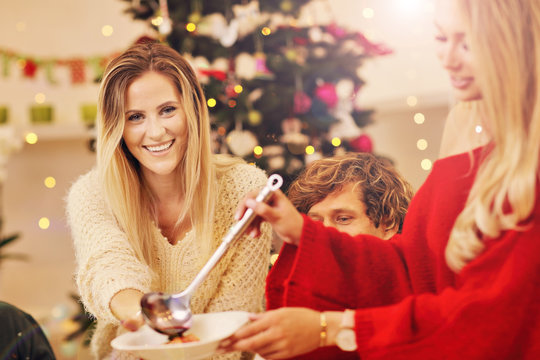 Group Of Family And Friends Celebrating Christmas Dinner