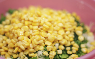 Fresh salad with canned corn, cabbage and parsle