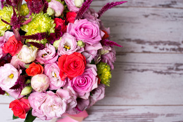 beautiful floral arrangement, pink and red rose, pink eustoma, yellow chrysanthemum