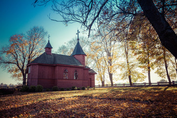 Wooden church in an autumn scenery