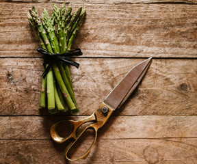 Freshly cut asparagus and brass scissors