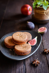 Star anise shortbread sandwiches filled with grated apple and fig mixture