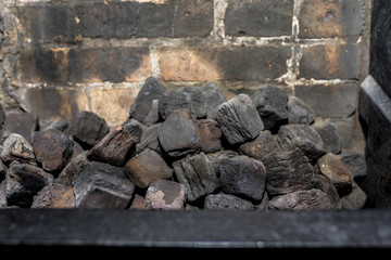 Coal in an unlit kitchen fireplace