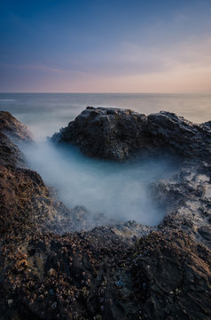 Water Rocks And Ocean At Dusk