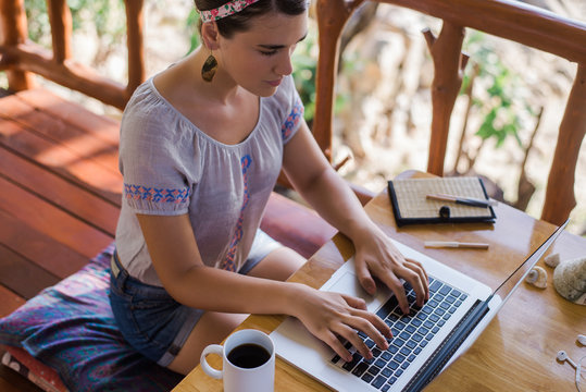 Young Woman Working on Computer Outdoors