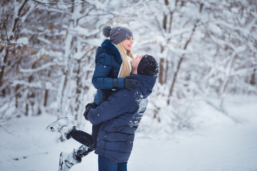 Fototapeta na wymiar Happy Couple Having Fun Outdoors in Snow Park. Winter Vacation