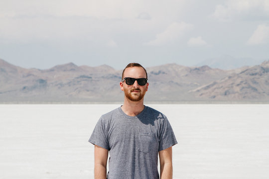 Lifestyle portrait of young man in desert salt flats usa utah